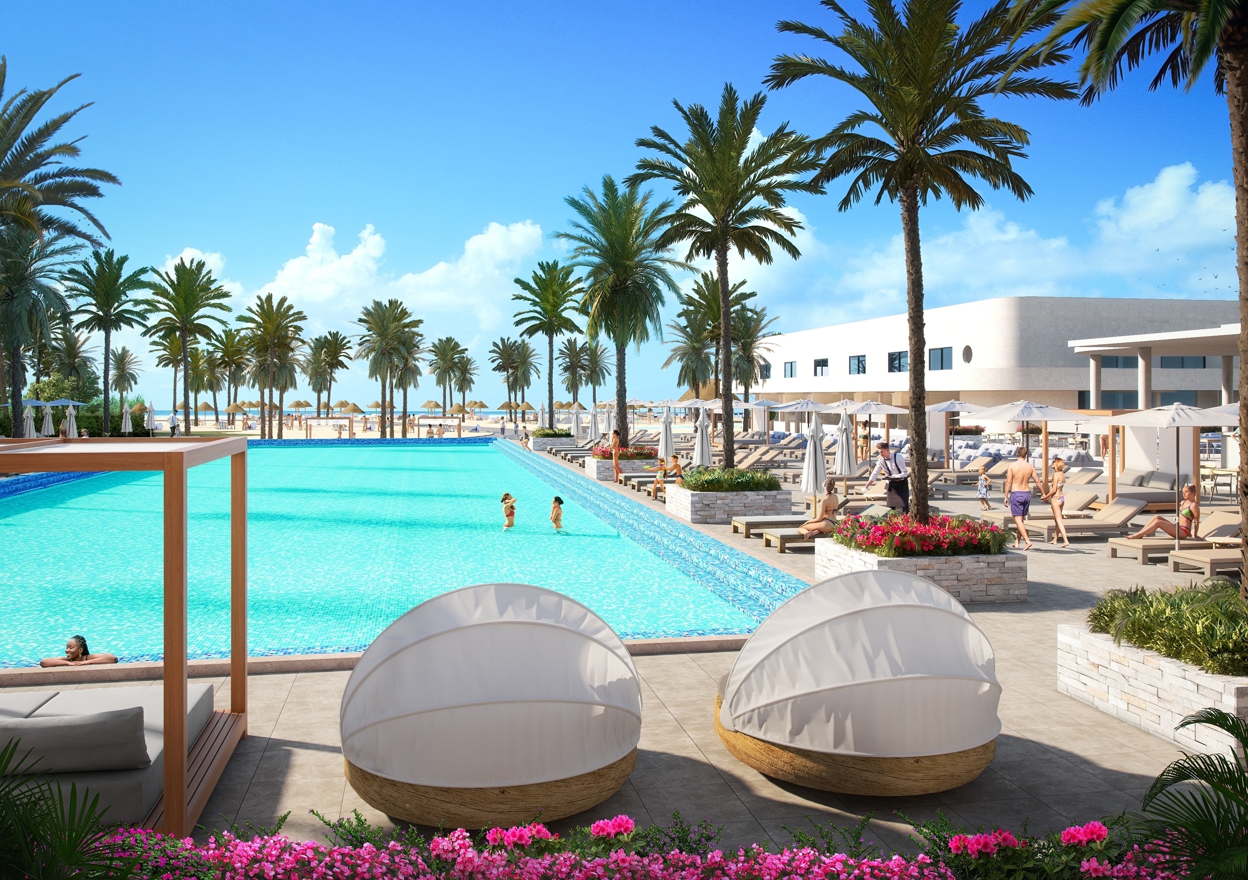 The Rif at Mangrove Beach pool area with poolside bar, palm trees and hotel buildings