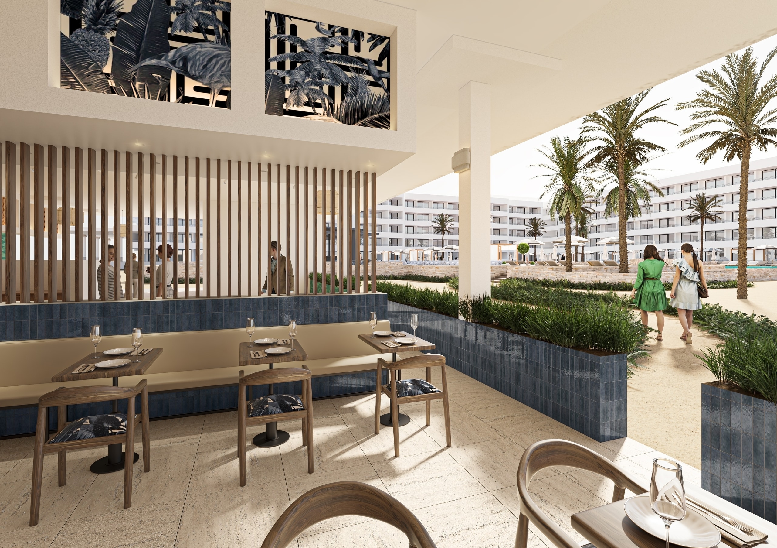 Restaurant at The Rif at Mangrove Beach opening toward the tropical resort grounds